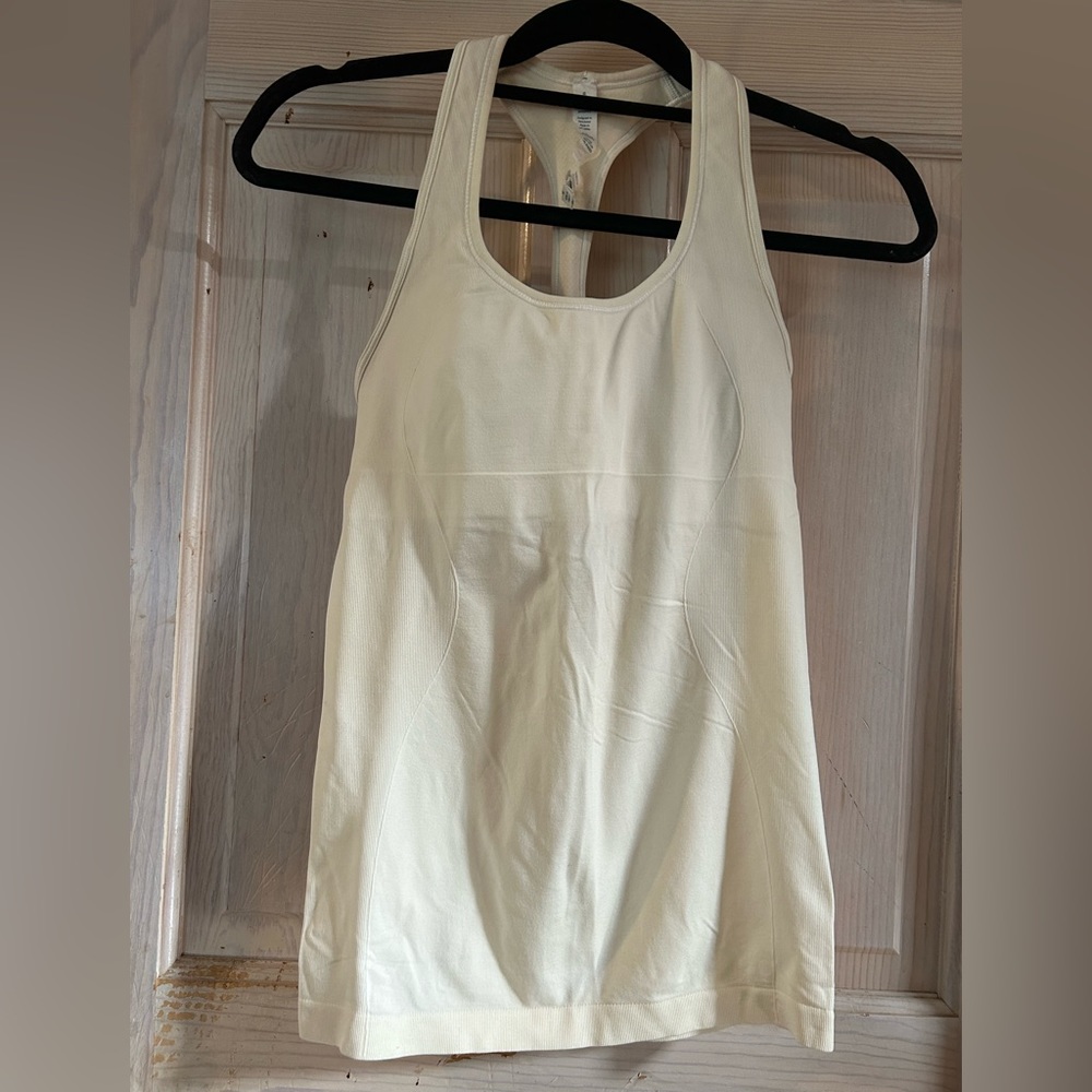Lululemon Racerback Tank in Pale Yellow.           Woman’s size 8